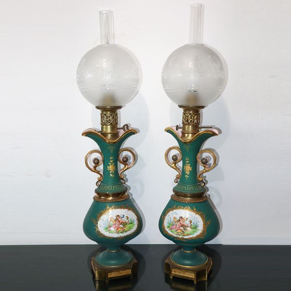 Pair of green porcelain lights with floral design in the center and glass ball bowl