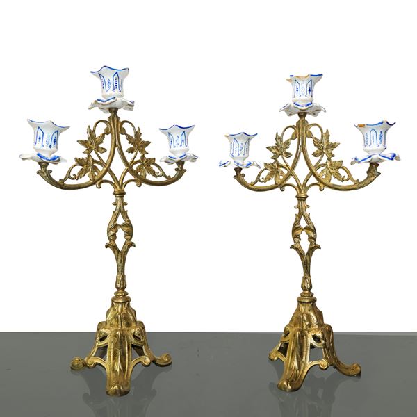 Pair of three-light candelabra in gilded metal and porcelain