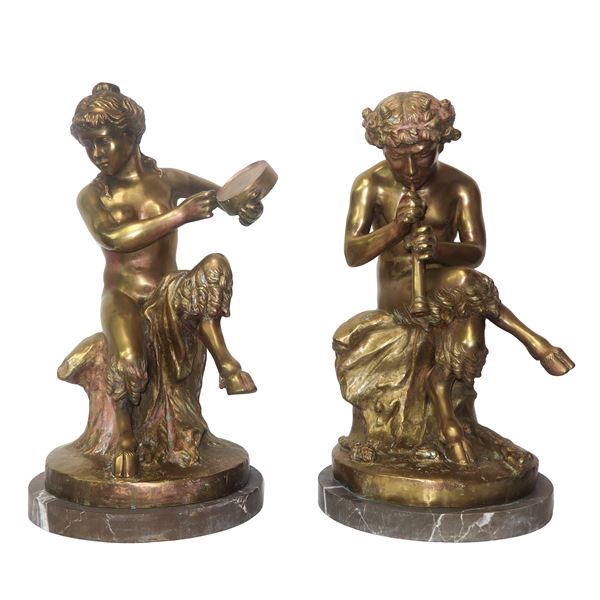 Fauns playing music, a pair of gold-patinated brass sculptures with a marble base