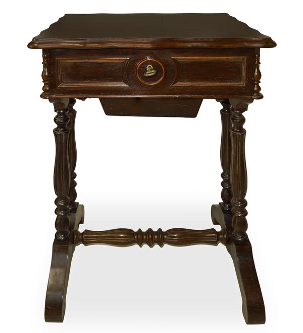 Small wooden table with central drawer