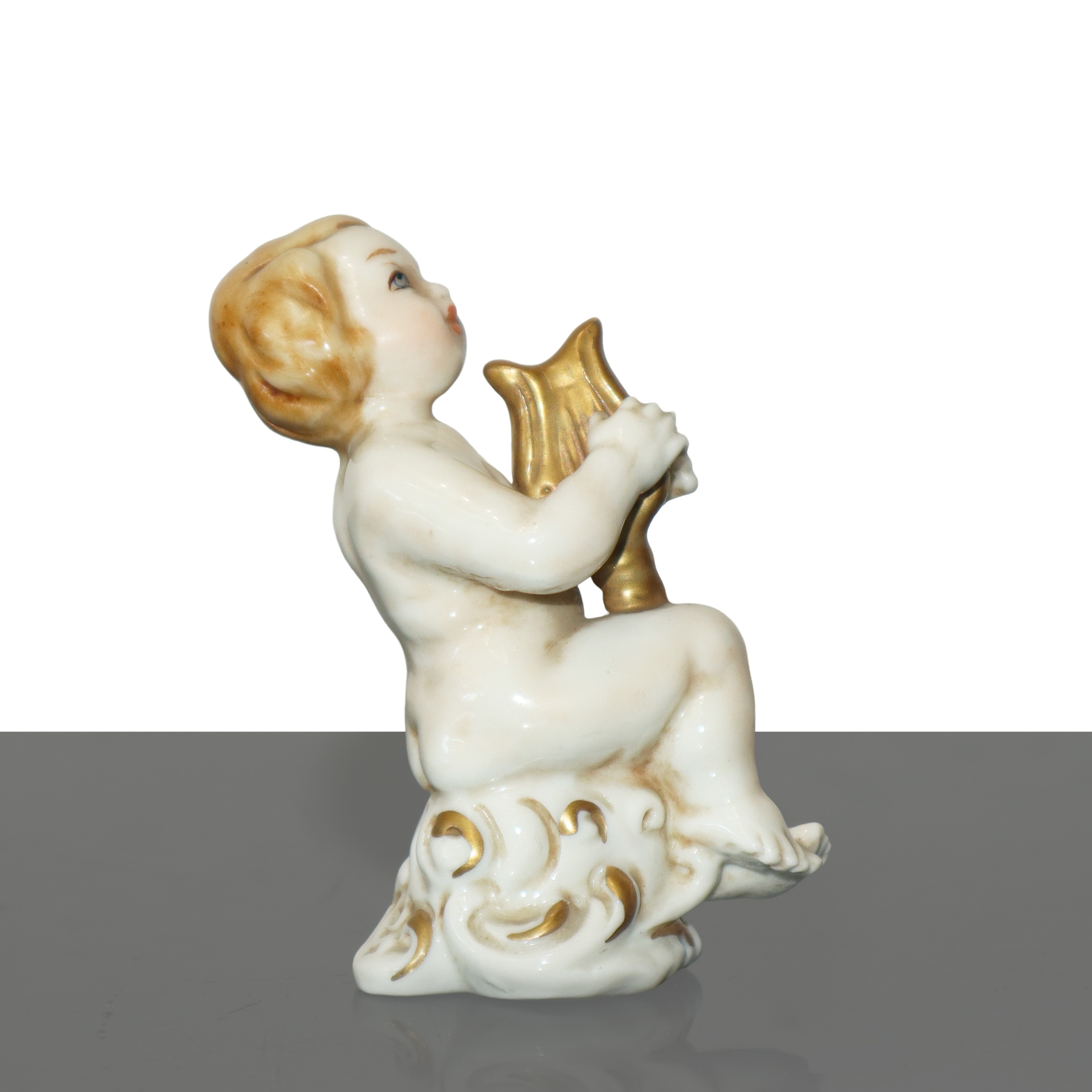 Cupido con arpa in porcellana di Capodimonte policroma