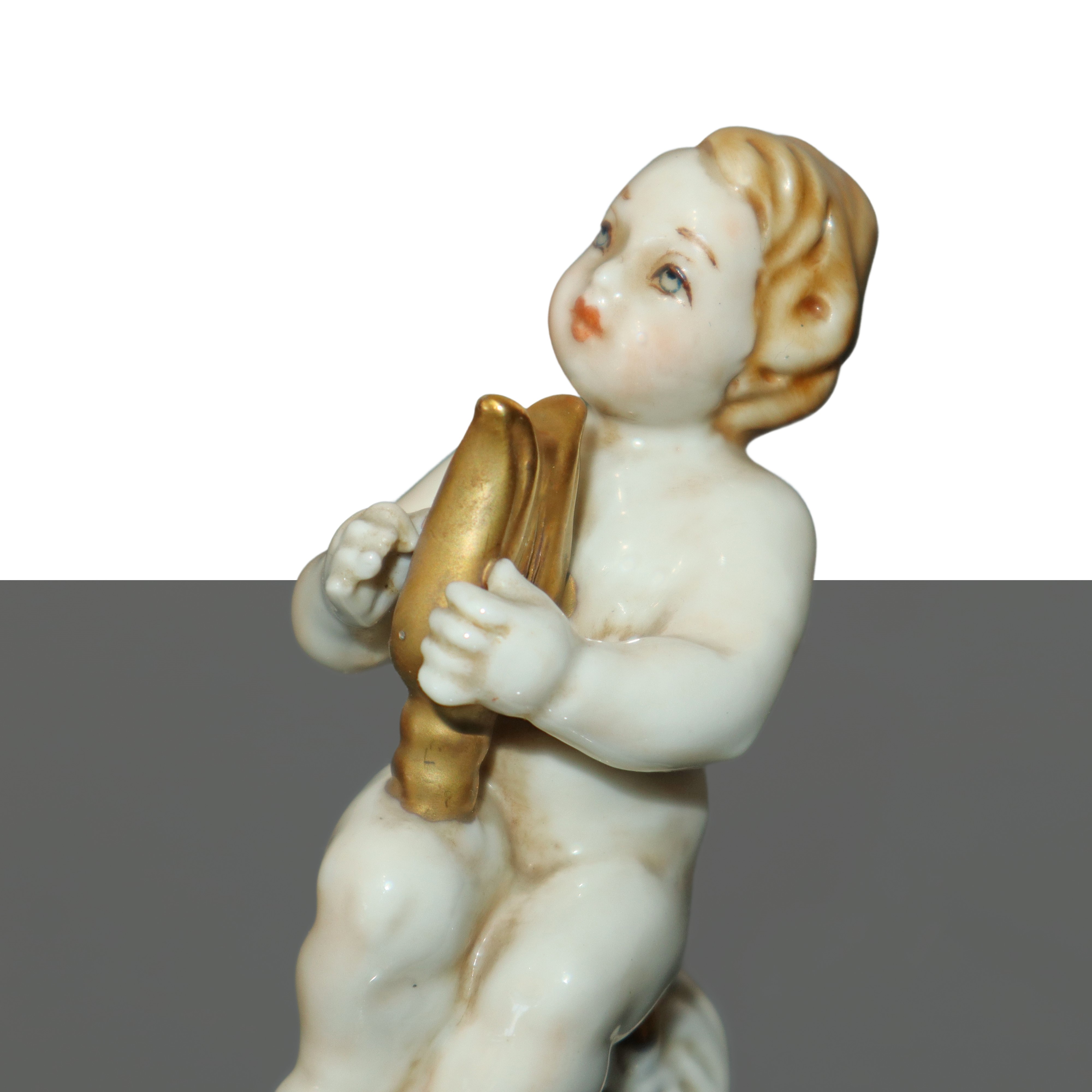 Cupido con arpa in porcellana di Capodimonte policroma