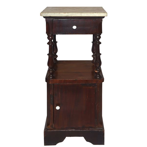 Bedside table with marble top, turned columns under the top and door at the base 