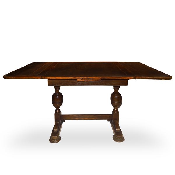 Extendable rectangular table/desk with turned bowl-shaped support connected by a central tie and slipper feet 