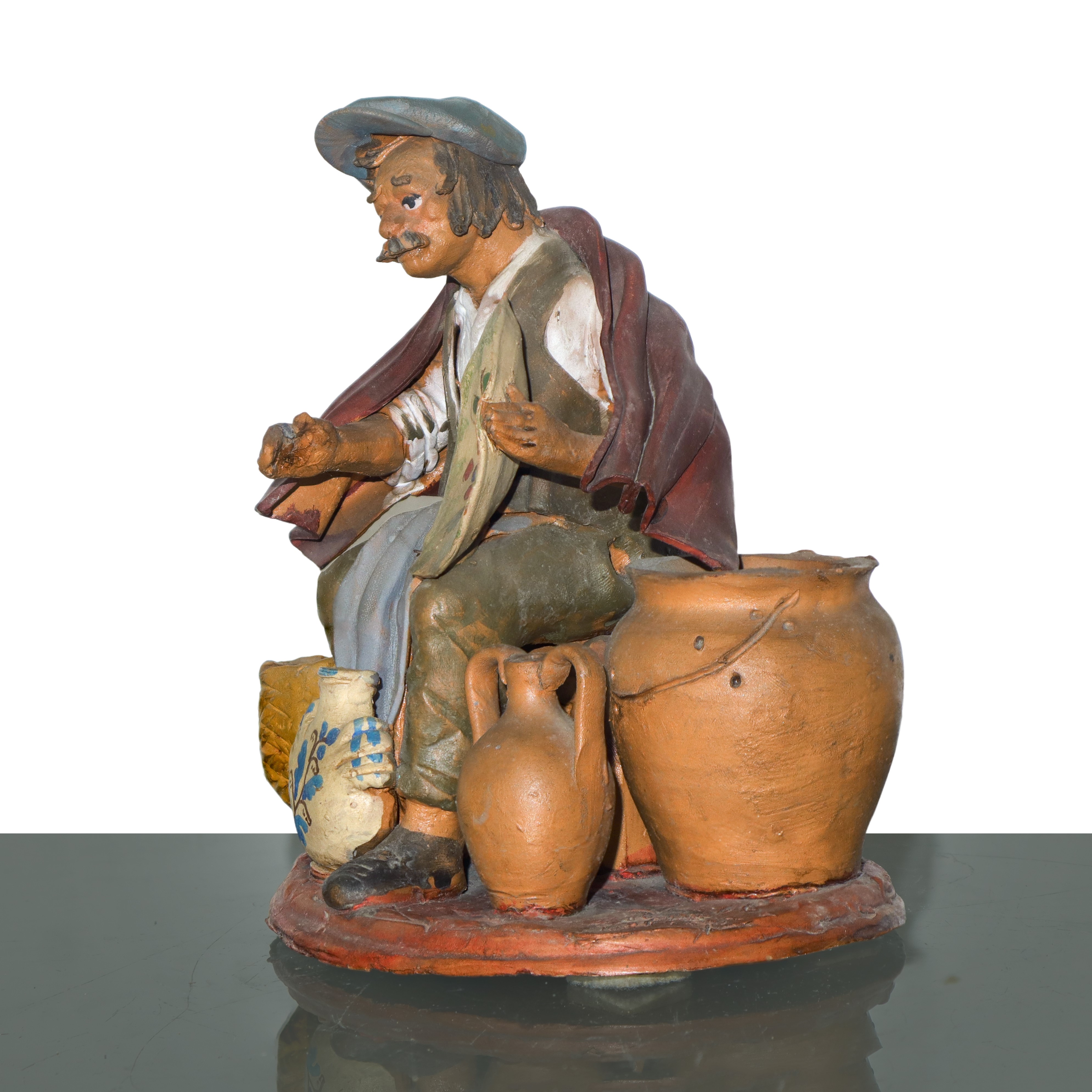 Vasaio, figurina in creta dipinta