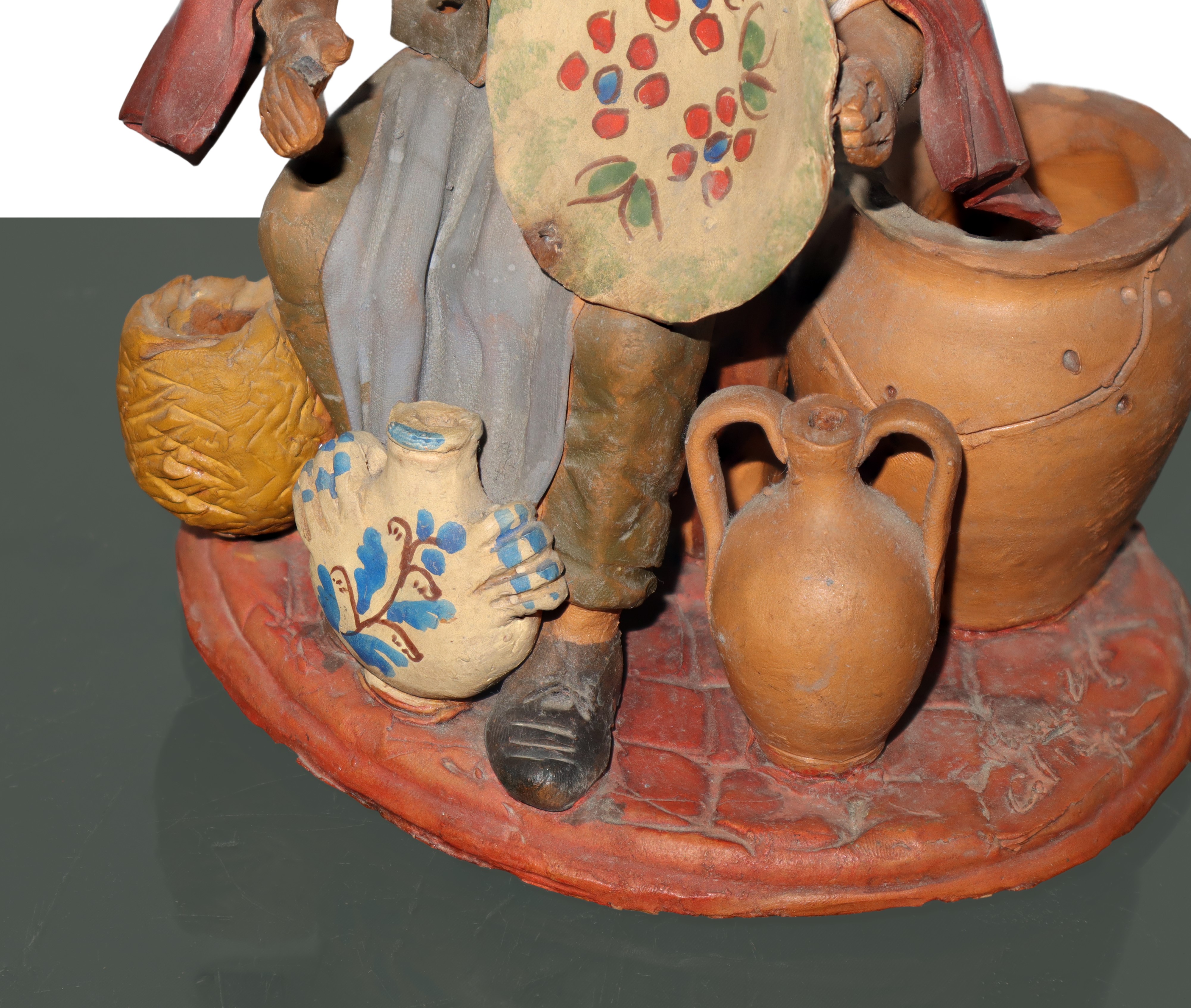 Vasaio, figurina in creta dipinta