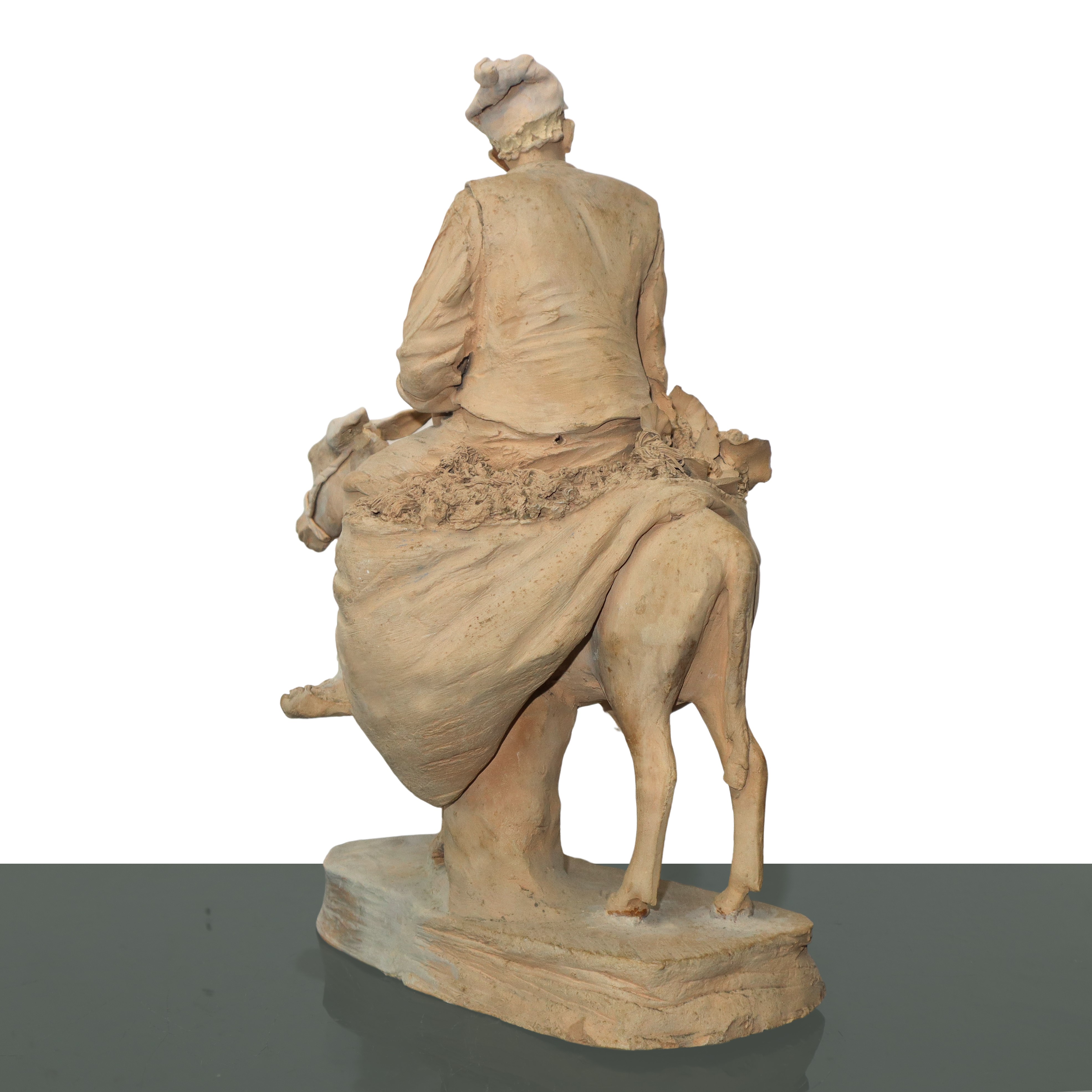 Contadino su un mulo, figura in terracotta