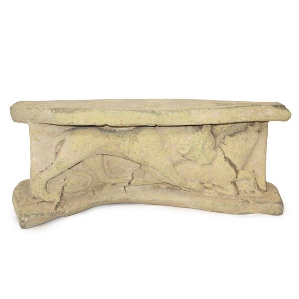 Fragment in cement mortar with a relief depiction of a lion attacking a wild boar  