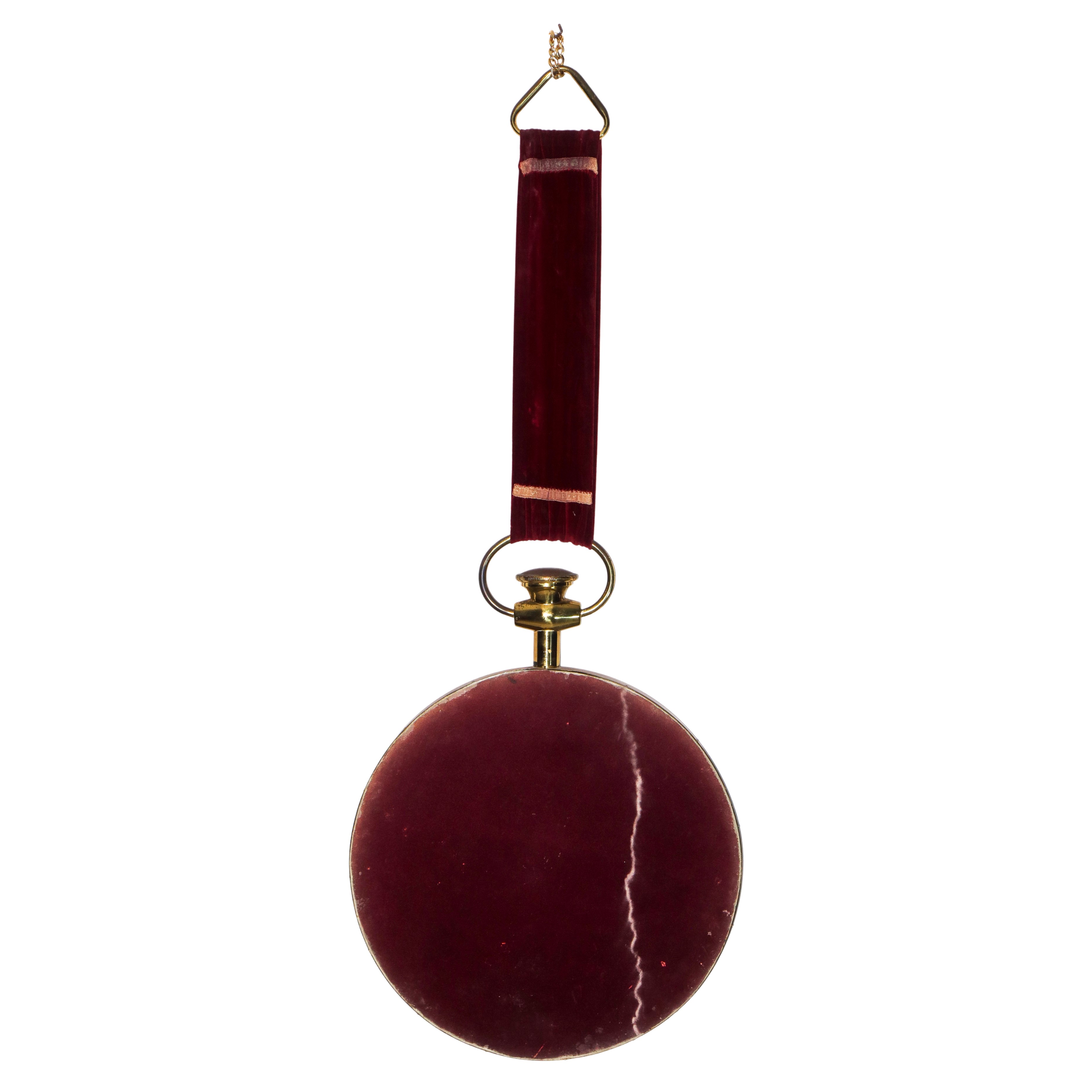 Specchiera tonda entro cornice dorata, con nastro in velluto rosso (XX secolo)