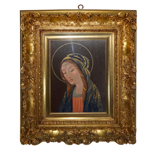 Volto di Maria entro cornice oro riccamente decorata