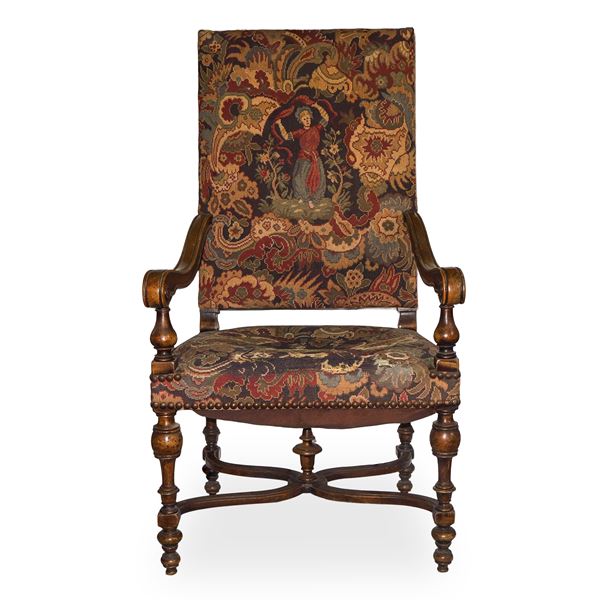 High chair with floral upholstery and decorated with genre figures