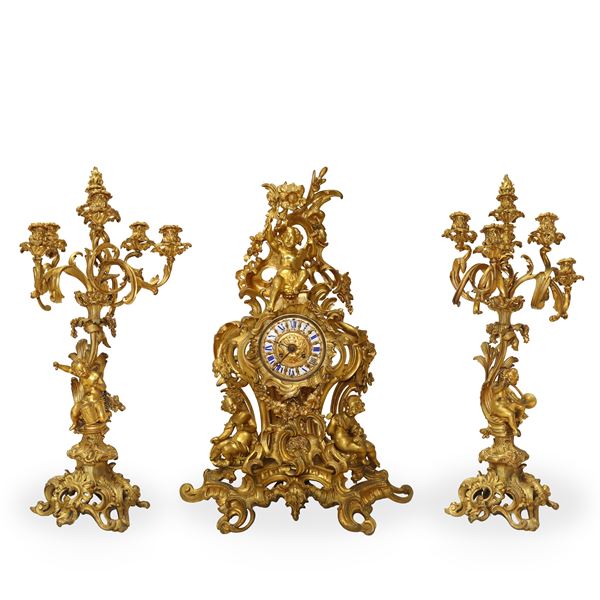 Jean-André Lepaute - Louis XVI triptych in gilded bronze composed of a clock and candelabra