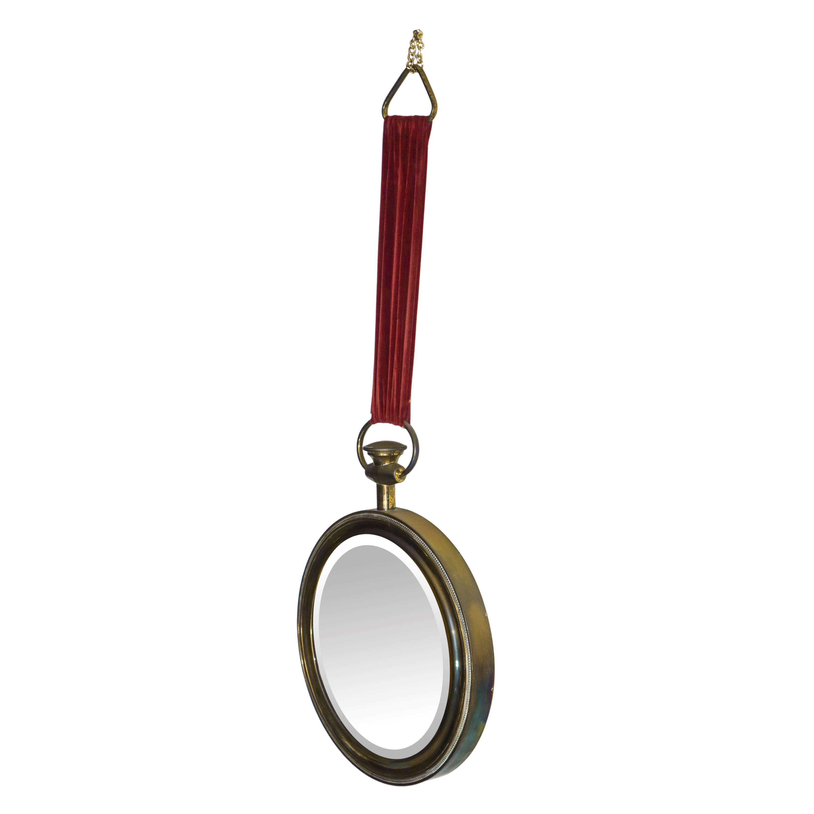 Specchiera tonda entro cornice oro pendente con nastro in velluto rosso