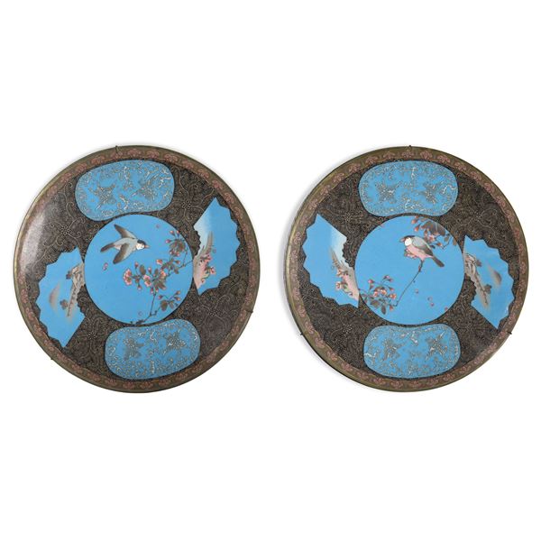 Pair of oriental porcelain wall plates decorated with blue enamels