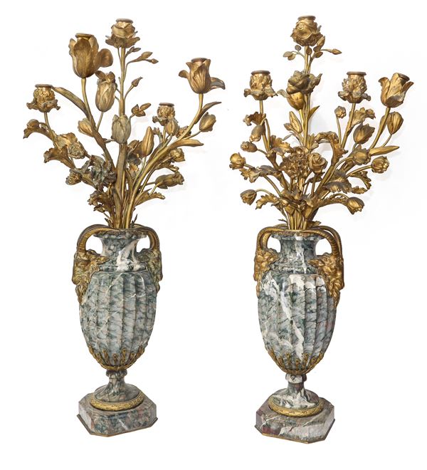 Pair of marble vases with bronzes applied in the shape of flowers and a 5-light candlestick