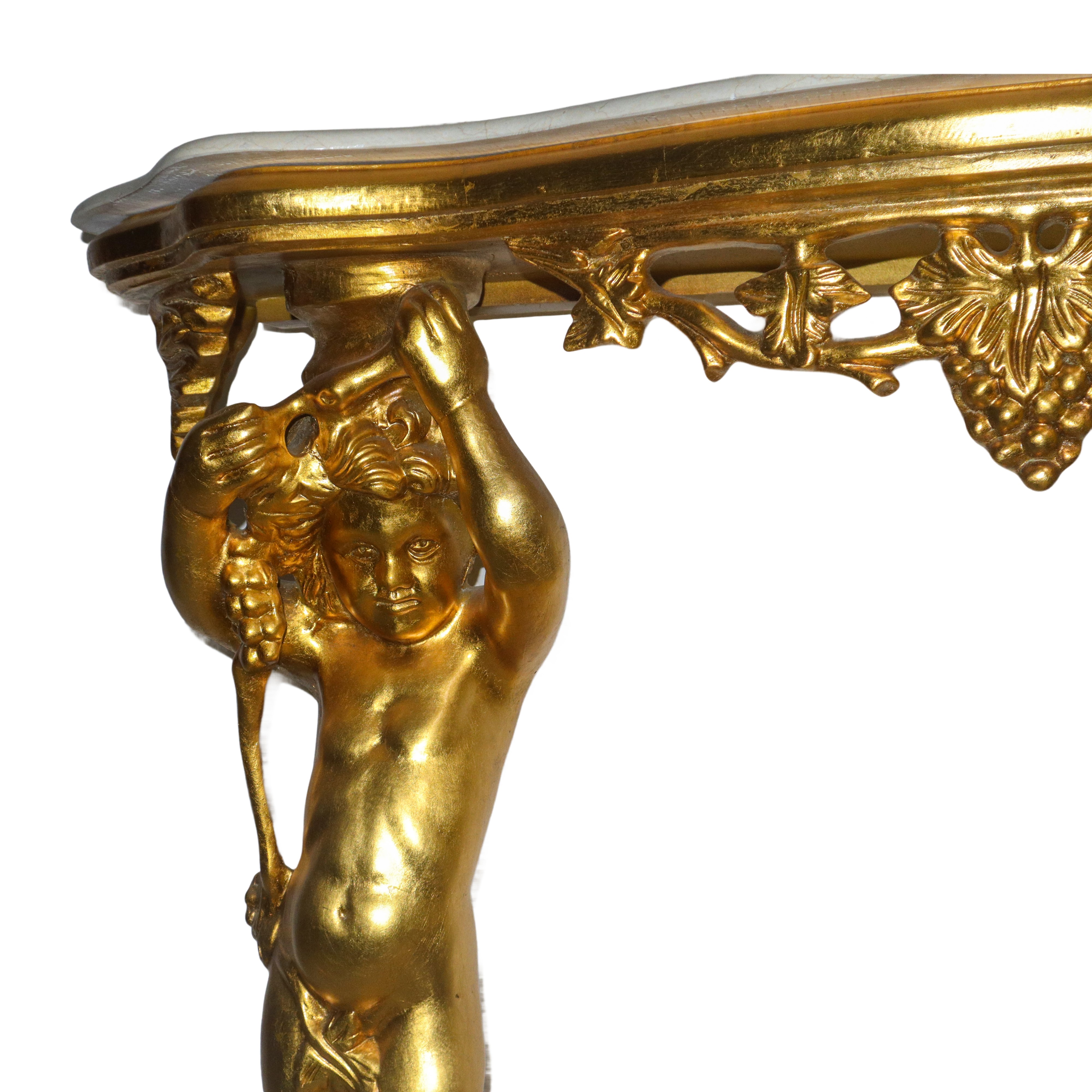 Consolle in legno dorato con piano in marmo bianco sorretto da due putti