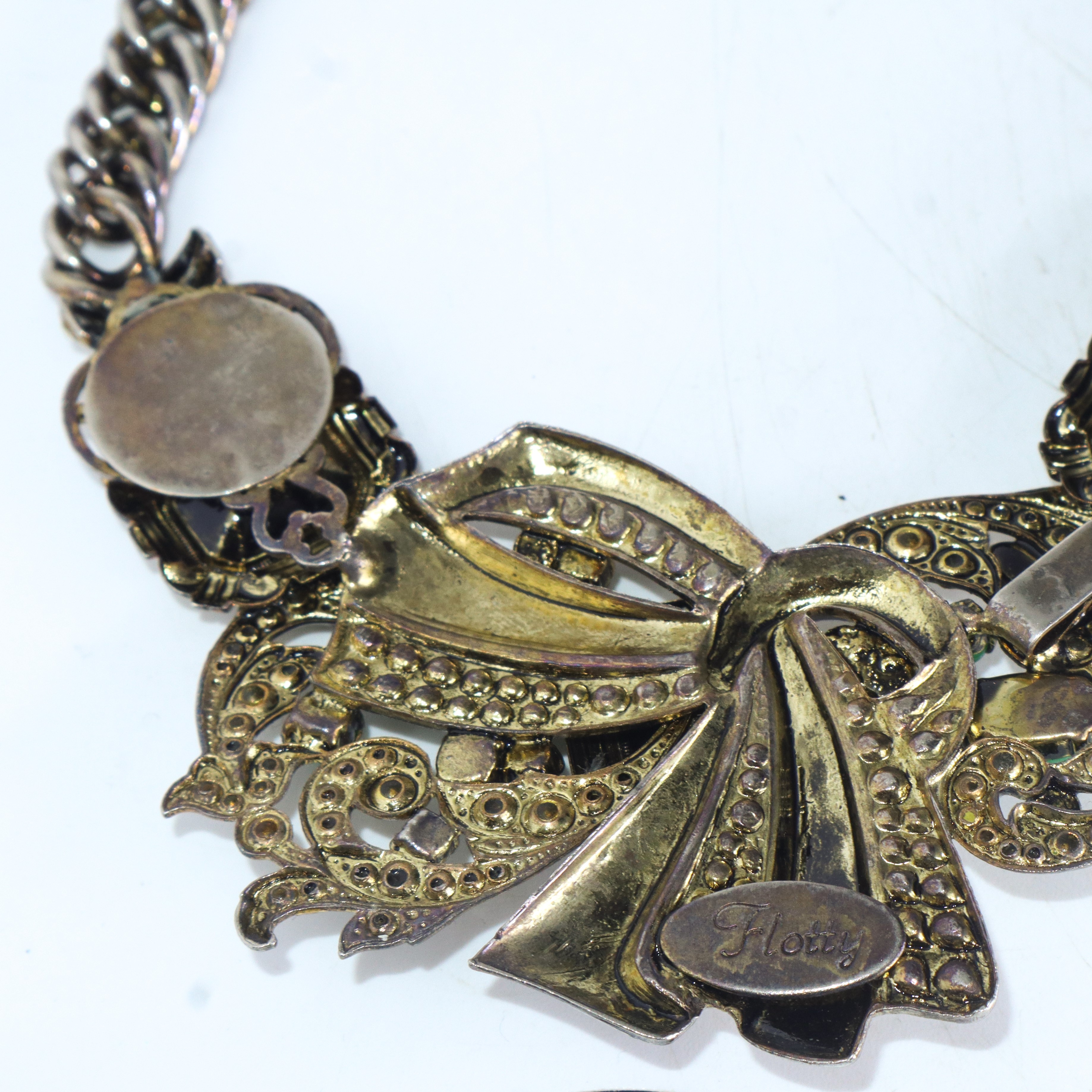Flotty Bijoux - Collana in metallo dorato e argentato con strass e pietre verdi