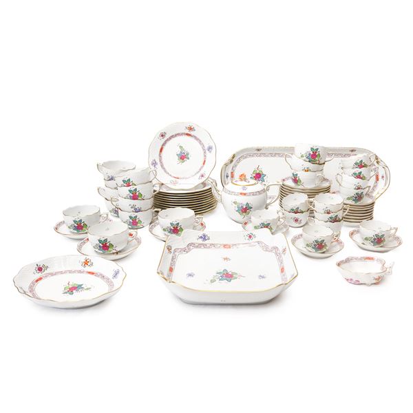 Herend  Hungary - Coffee and tea set "Apponyi" model in white porcelain with typical polychrome floral decoration on a white background, ozier edge and gold trim