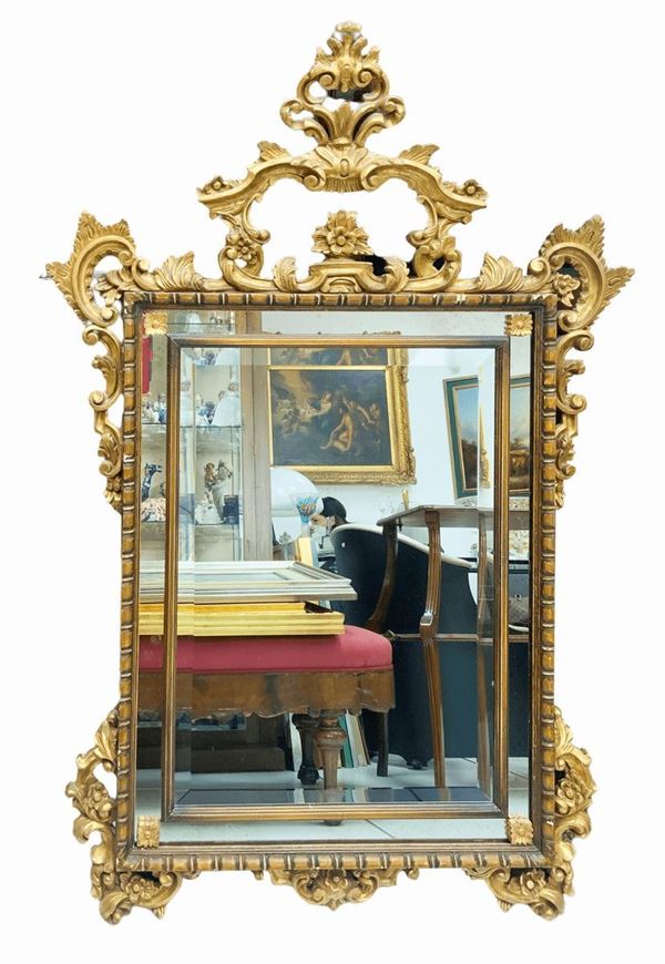 Mirror with bevelled mirror in gilded wood Leaf. 130x93 cm