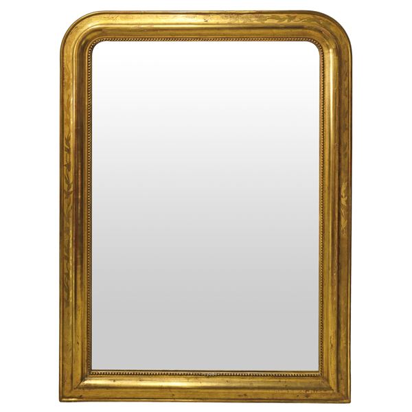 Mirror with gold leaf frame with floral motifs