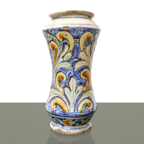 Caltagirone majolica albarello vase painted in polychrome with floral and leaf decorations