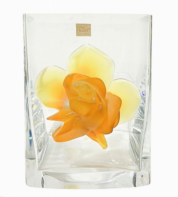 Lalique vessel "Amber Rose", vase in transparent glass. France, with a pink applied to the front modeled in amber. Signed on the lalique base ...