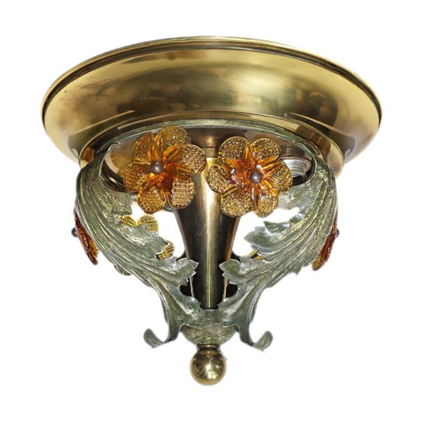 Small golden ceiling light with floral decorations in amber glass and leaves