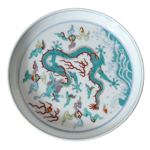 Polychrome Chinese porcelain plate with dragon decoration and metal base