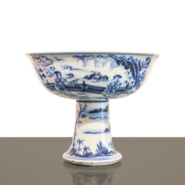 Antique and elegant Chinese porcelain cake stand in shades of white and blue with genre scenes