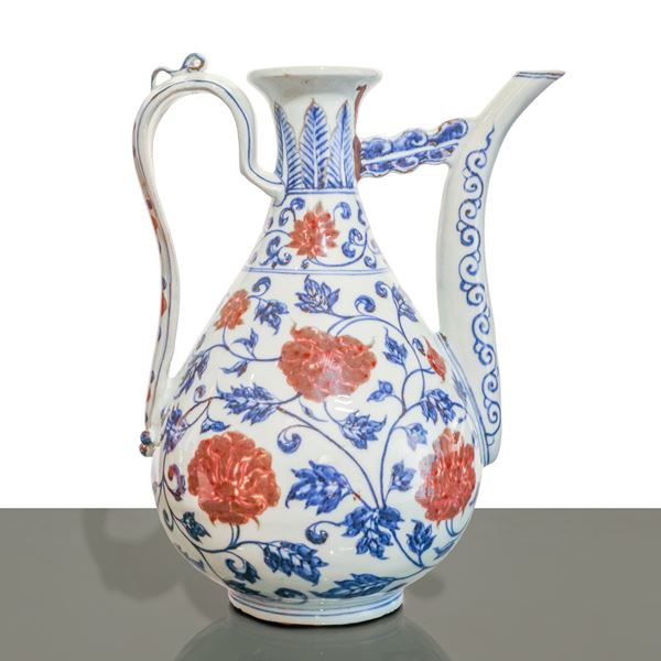 Large blue and white porcelain teapot with red decorations from the Ming Dynasty.