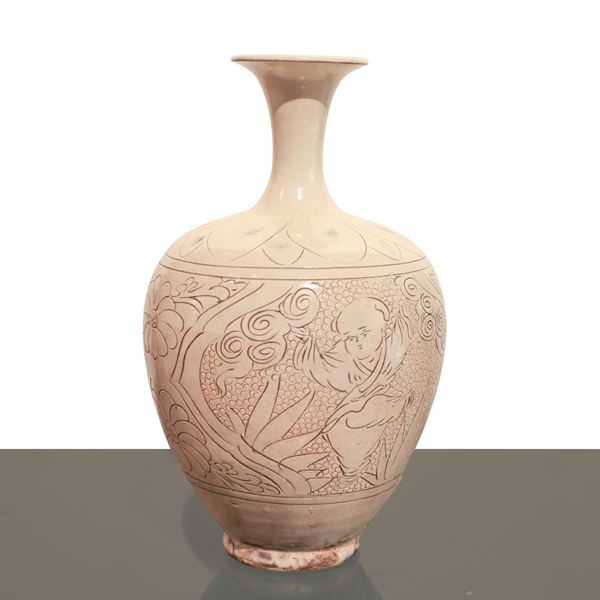 Chinese porcelain vase with white enamel coating with engraved decorative motifs