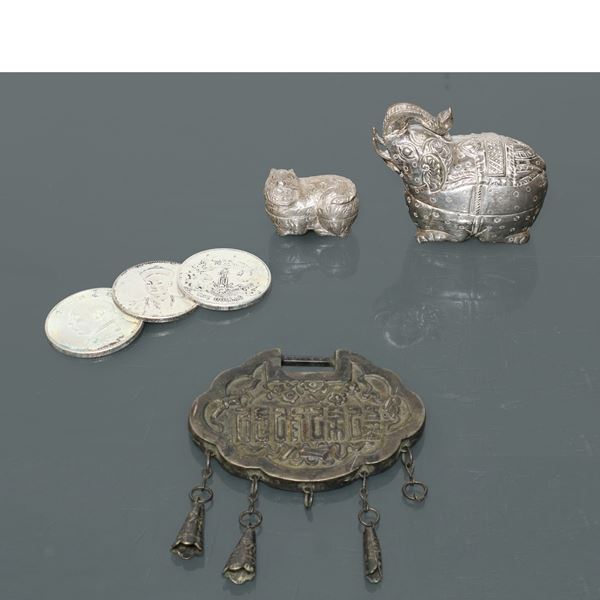 Group of Chinese coins and lucky objects in silver metal