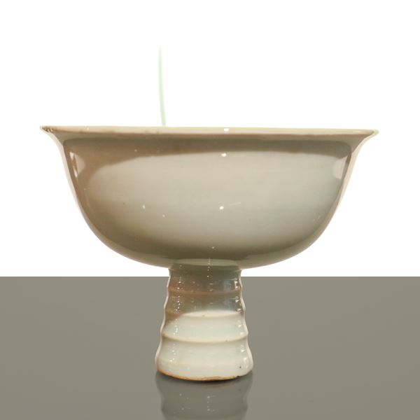 Chinese porcelain centerpiece cup with dragon decoration and inscription in the center of the cup