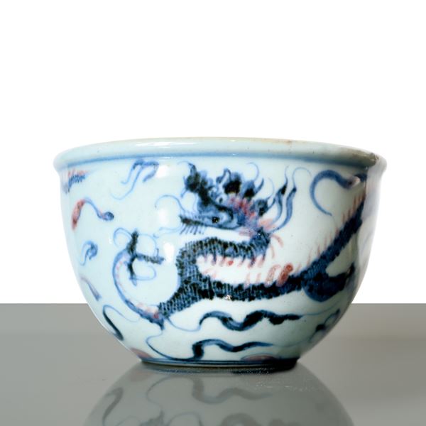 Chinese porcelain bowl with white, blue and red dragon decoration