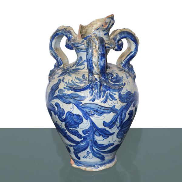 Amphora with three handles in Savona majolica glazed with blue phytomorphic and plant decorations on a white background