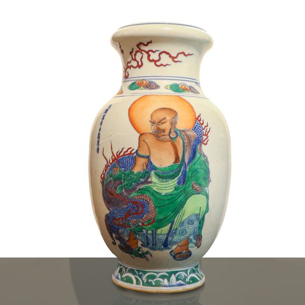 A Chinese polychrome porcelain vase from the Guangxu period with decoration depicting an Arhat.