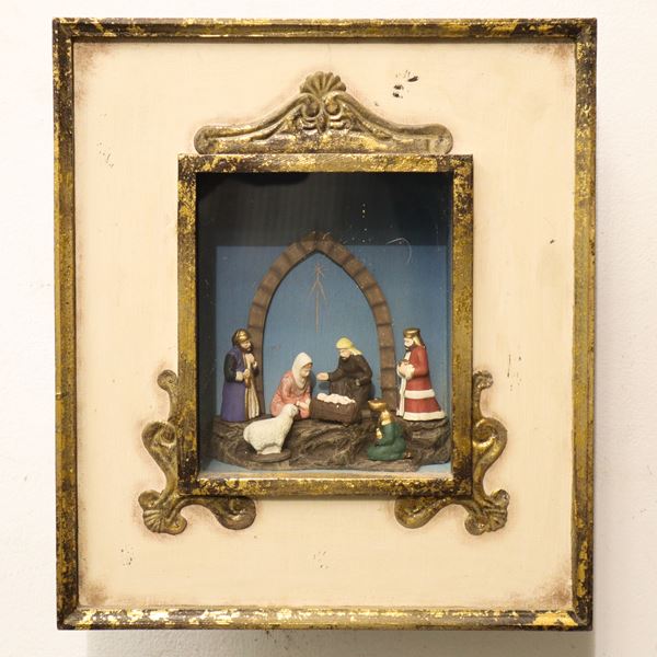 Terracotta nativity scene within a lacquered and gilded wooden frame/case