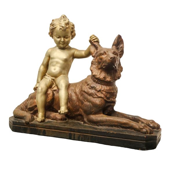 Bambino con lupo, scultura in terracotta policroma e dorata