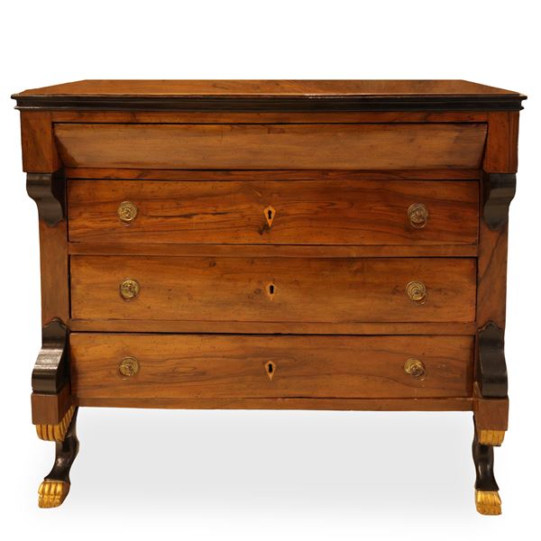 Empire chest of drawers with three drawers, goat feet in walnut decorated in gold.