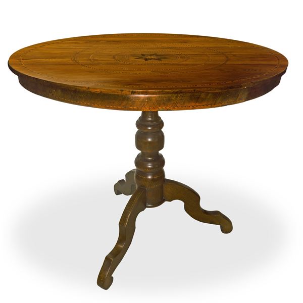 Role table inlaid on the top with concentric circles and star in the center with support with three-spoke foot entirely inlaid in light woods