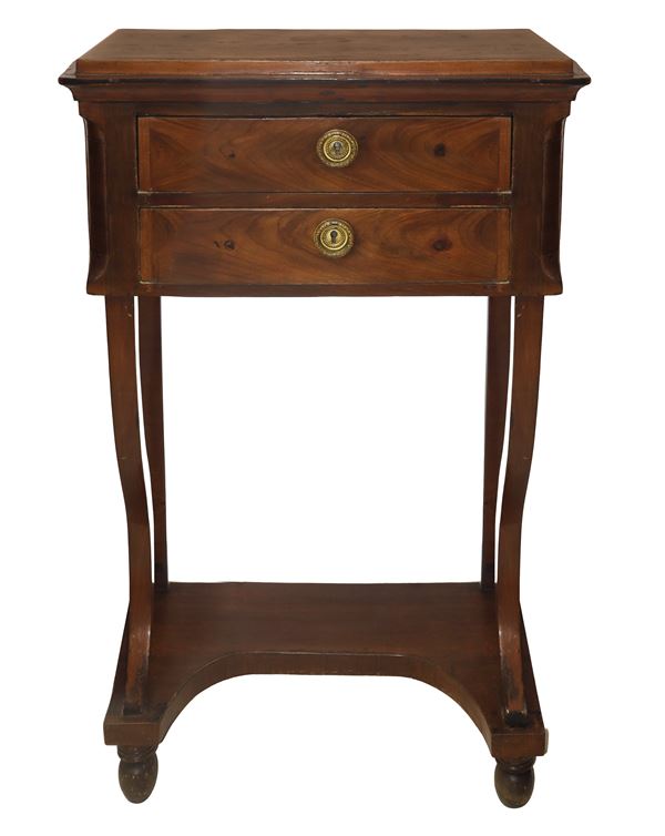 Charles X tall cabinet with two drawers in walnut with sabre legs and egg-shaped feet