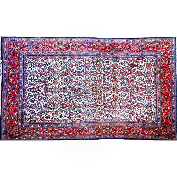 Rug with floral decorations on a blue background on the outside and an ecru background in the central square 