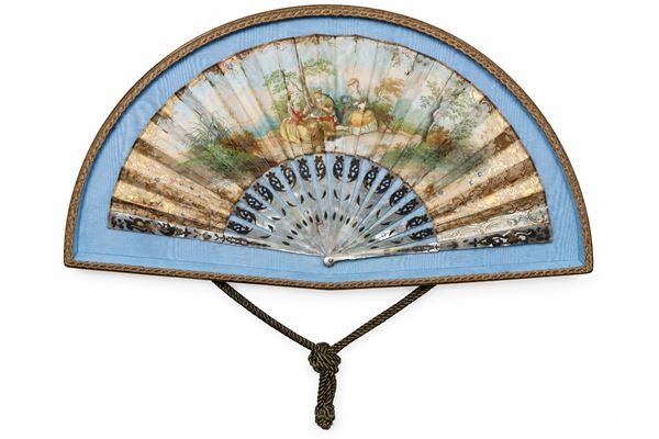 Fan with genre scene inside a case lined with blue fabric
