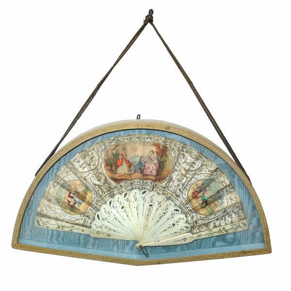 Fan with genre scene inside a case lined with blue fabric