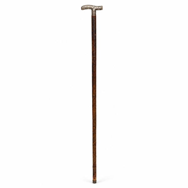 Walking stick with silver handle inlaid with floral motifs in relief