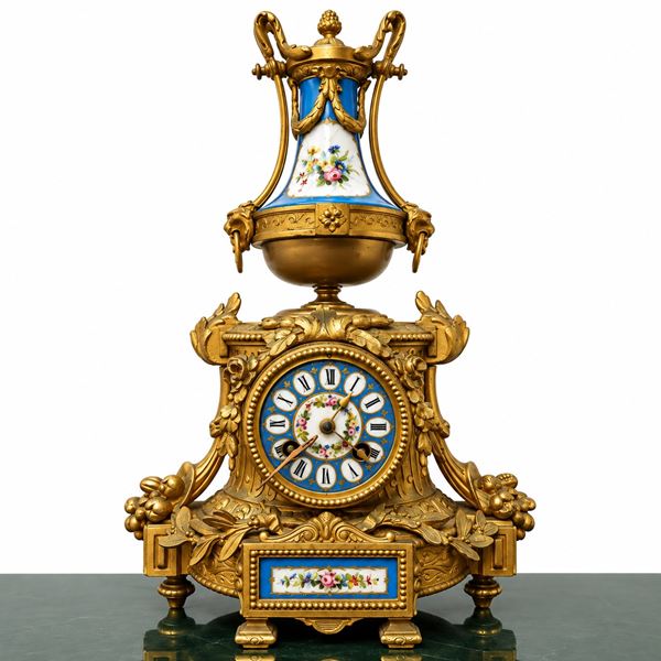 Gilded clock with Sevres porcelain inserts
