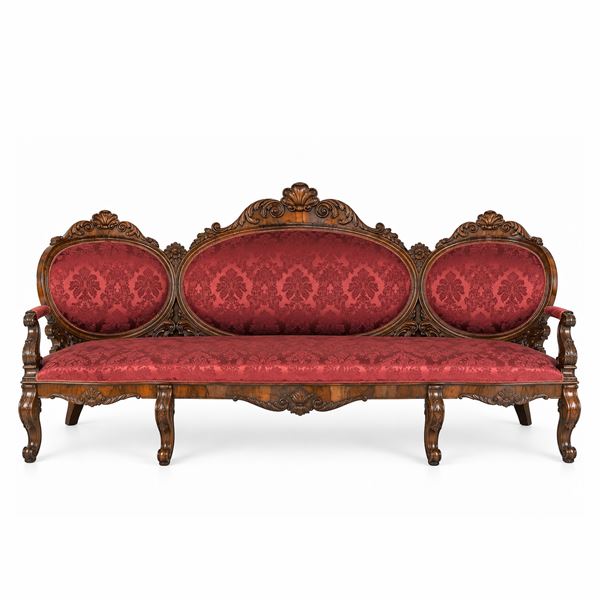 Louis Philippe three-seater sofa with medallion backrests, carved wooden frame and burgundy damask upholstery
