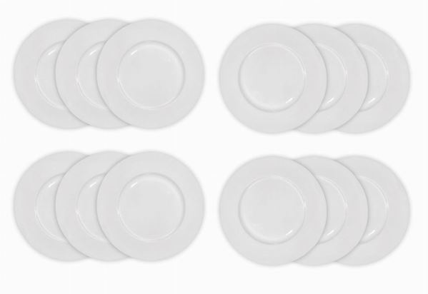 Group of 12 underplate in white porcelain. The Coquet Limoges-France. Muscade forms. Diameter 30.5 cm. 
