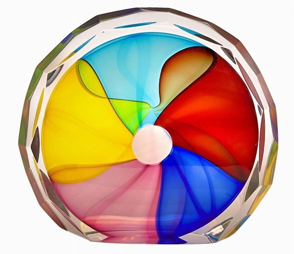 Sculpture in heavy glass of circular shape with polychrome vitreous pasta inclusions. Surface bearing polished bevel. H 22 cm x26
