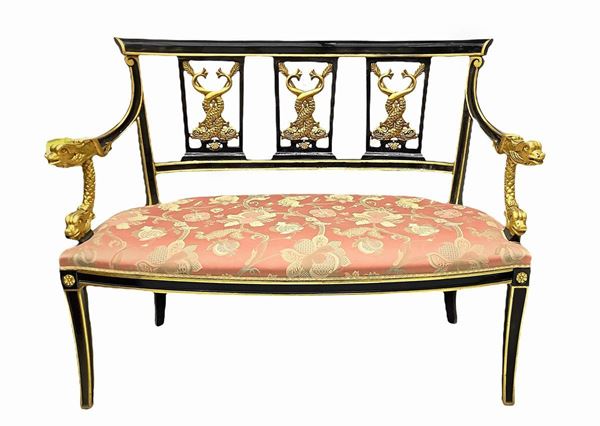 Sofa Napoleon III-style black lacquered wood and gilded details, mid-twentieth century. H cm 93x 125. Depth 65 cm